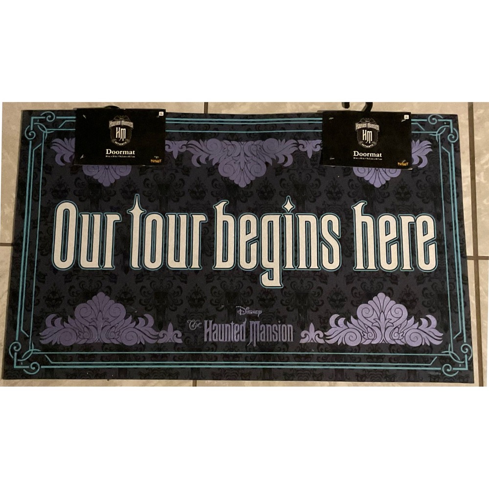 Disney haunted mansion "Our tour begins here" doormat Halloween NWT